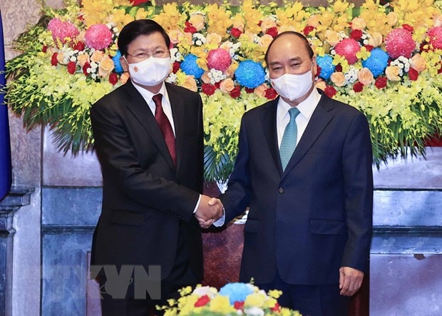 Chuyến thăm Việt Nam của Tổng Bí thư, Chủ tịch Lào: Cột mốc lịch sử hình ảnh 2 Chuyen tham Viet Nam cua Tong Bi thu, Chu tich Lao: Cot moc lich su hinh anh 2