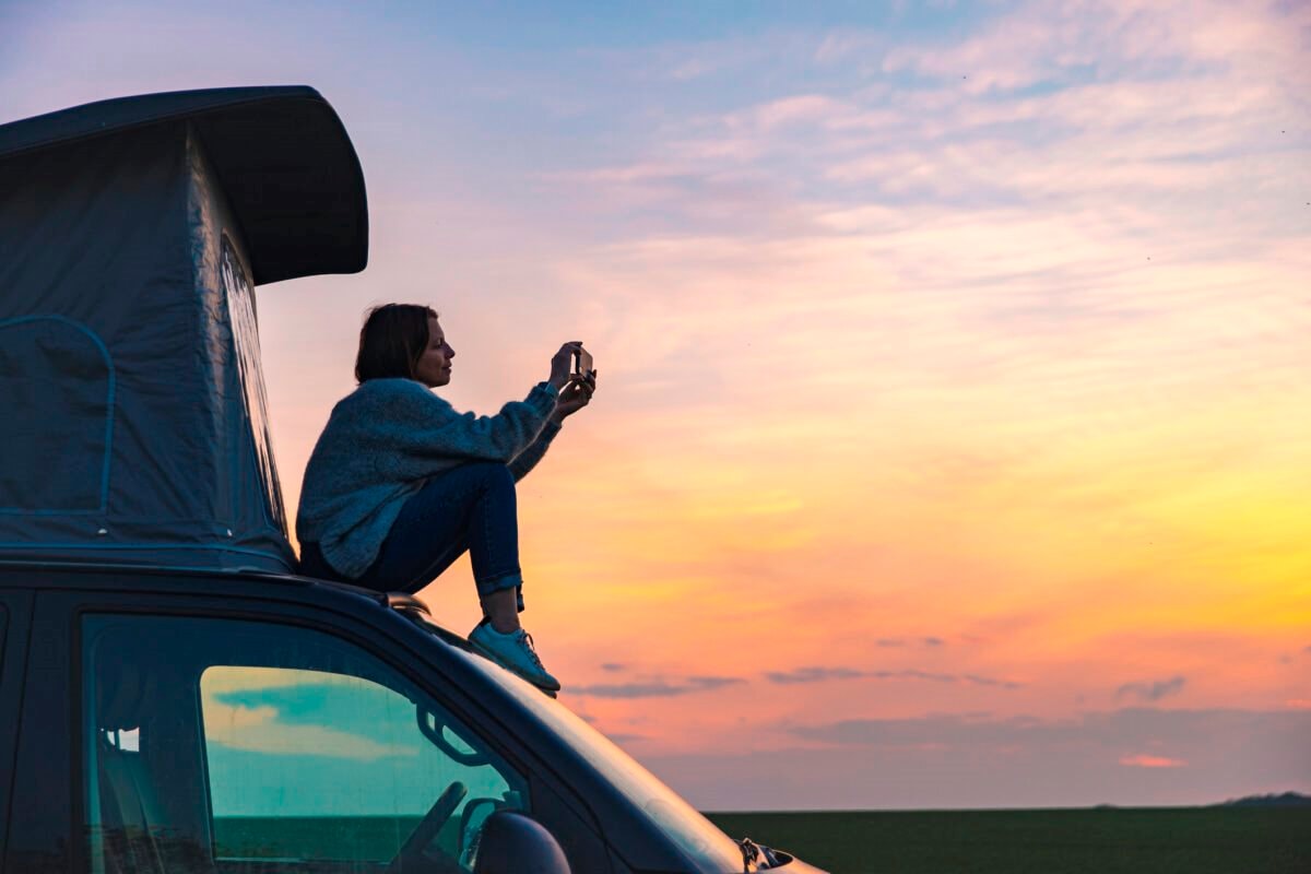 woman-on-top-of-campervan-1200x800-1(1).jpeg