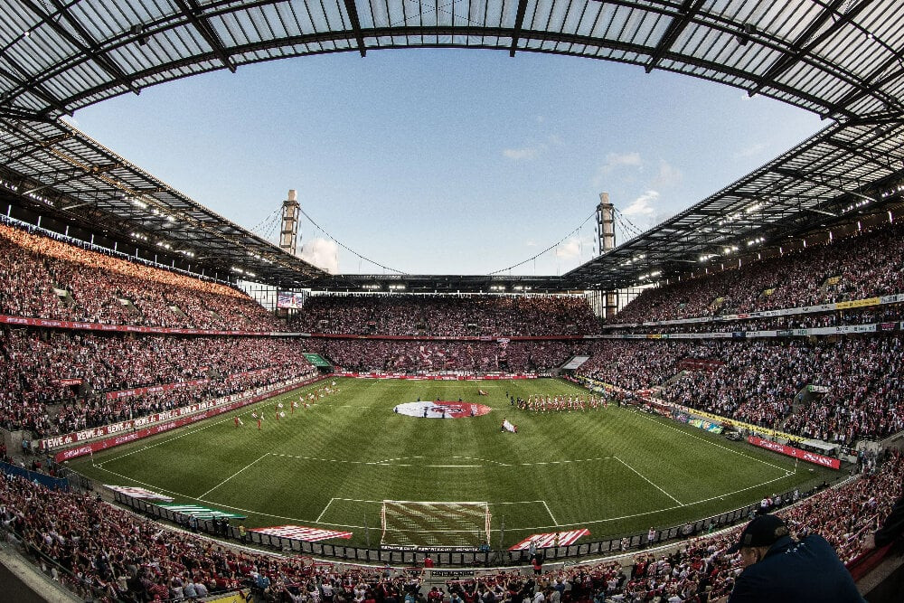 Sân Rhein Energie thuộc sở hữu của FC Koln, với sức chứa 43.000 khán giả. Sân được xây dựng lại từ sân Mungersdorfer để phục vụ cho World Cup 2006. 4 tòa tháp ở các góc sân là những gì còn được giữ lại từ sân bóng cũ. Như nhiều sân bóng khác ở Đức, mái che của Rhein Energie có thể đóng mở, qua đó cung cấp không gia phù hợp cho từng sự kiện khác nhau.