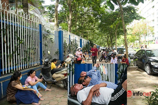 Hà Nội: Phụ huynh 'đội nắng', tranh thủ ngủ trên xe chờ con thi ở ngoài cổng trường