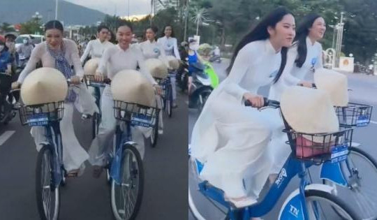 Nam Em và á hậu Kiều Loan mặc áo dài 'đua' xe đạp